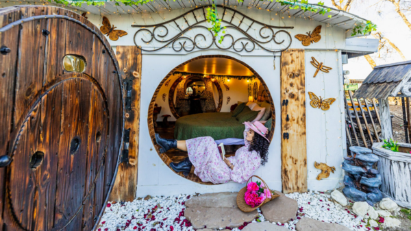 Texas Influencer @mycurlyadventures at the Hobbit House Airbnb in McKinney