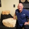 Dr. Scott with upper socket stone from the gate of the city in the Joshua Judges Jesus Exhibit in Texas