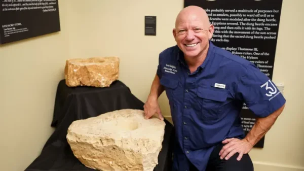 Dr. Scott with upper socket stone from the gate of the city in the Joshua Judges Jesus Exhibit in Texas