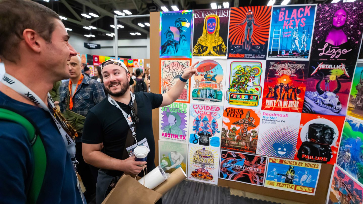 Art, music, and culture collide at SXSW! 🎨🎶 Festival-goers explore stunning gig posters featuring legendary artists and fresh designs. | Source: sxsw.com
