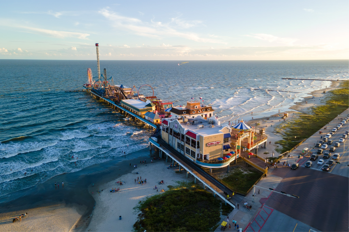Thrills over the waves — where seaside fun meets unforgettable sunsets at Galveston’s Historic Pleasure Pier. | Source: visithoustontexas.com