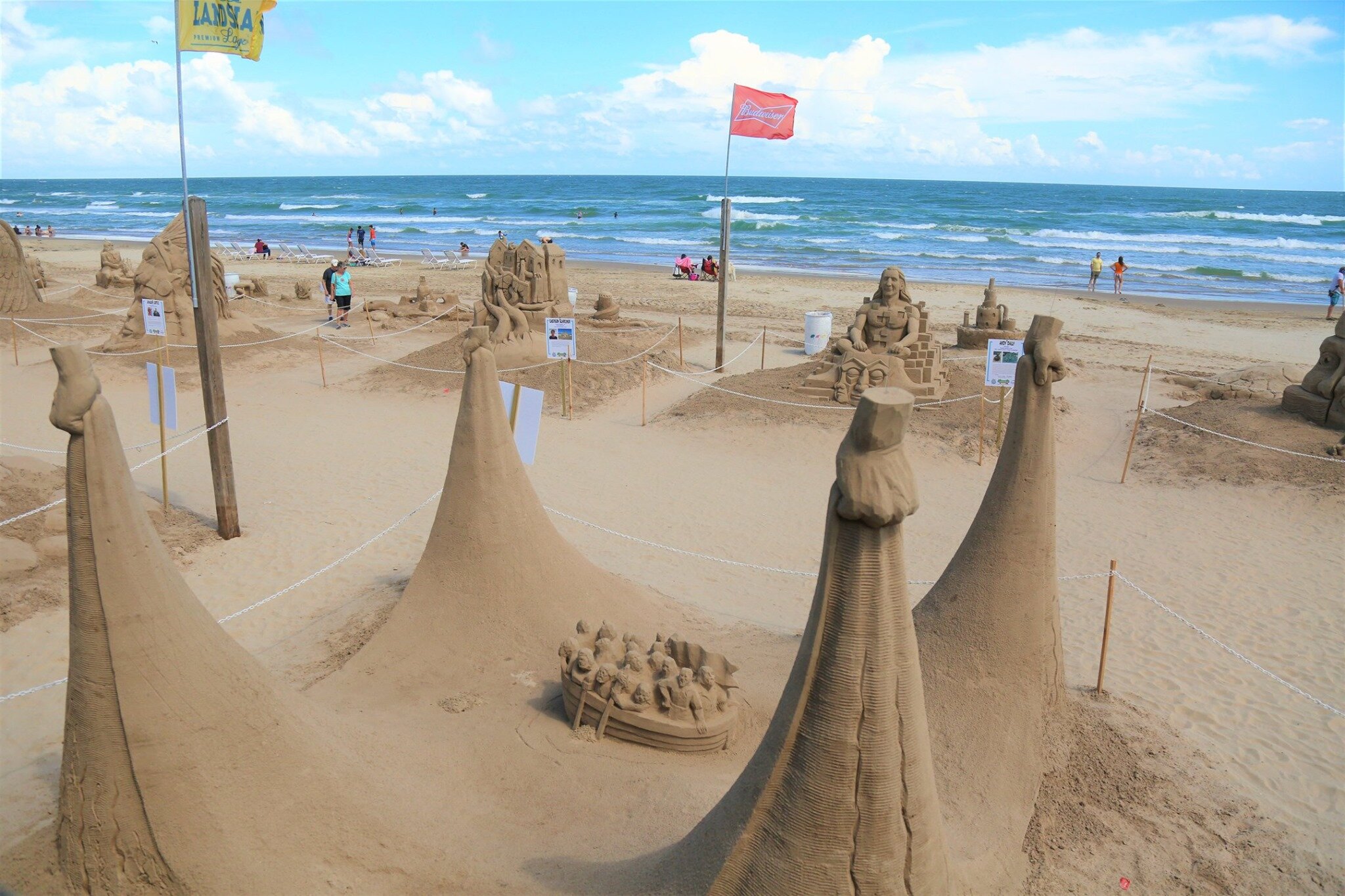 Large sand sculptures displayed on South Padre Island beach during the annual Sandcastle Days event.