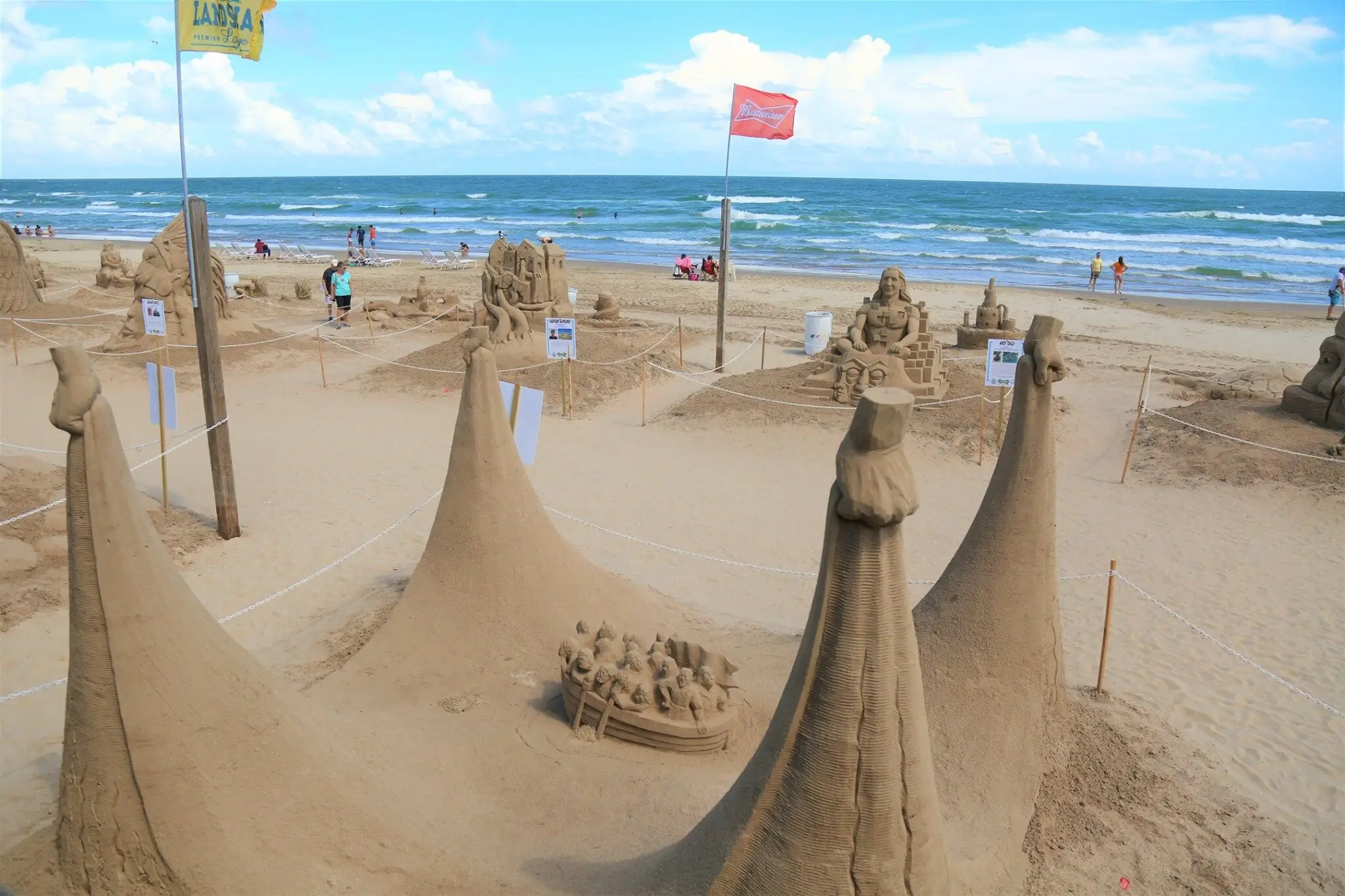 Large sand sculptures displayed on South Padre Island beach during the annual Sandcastle Days event.