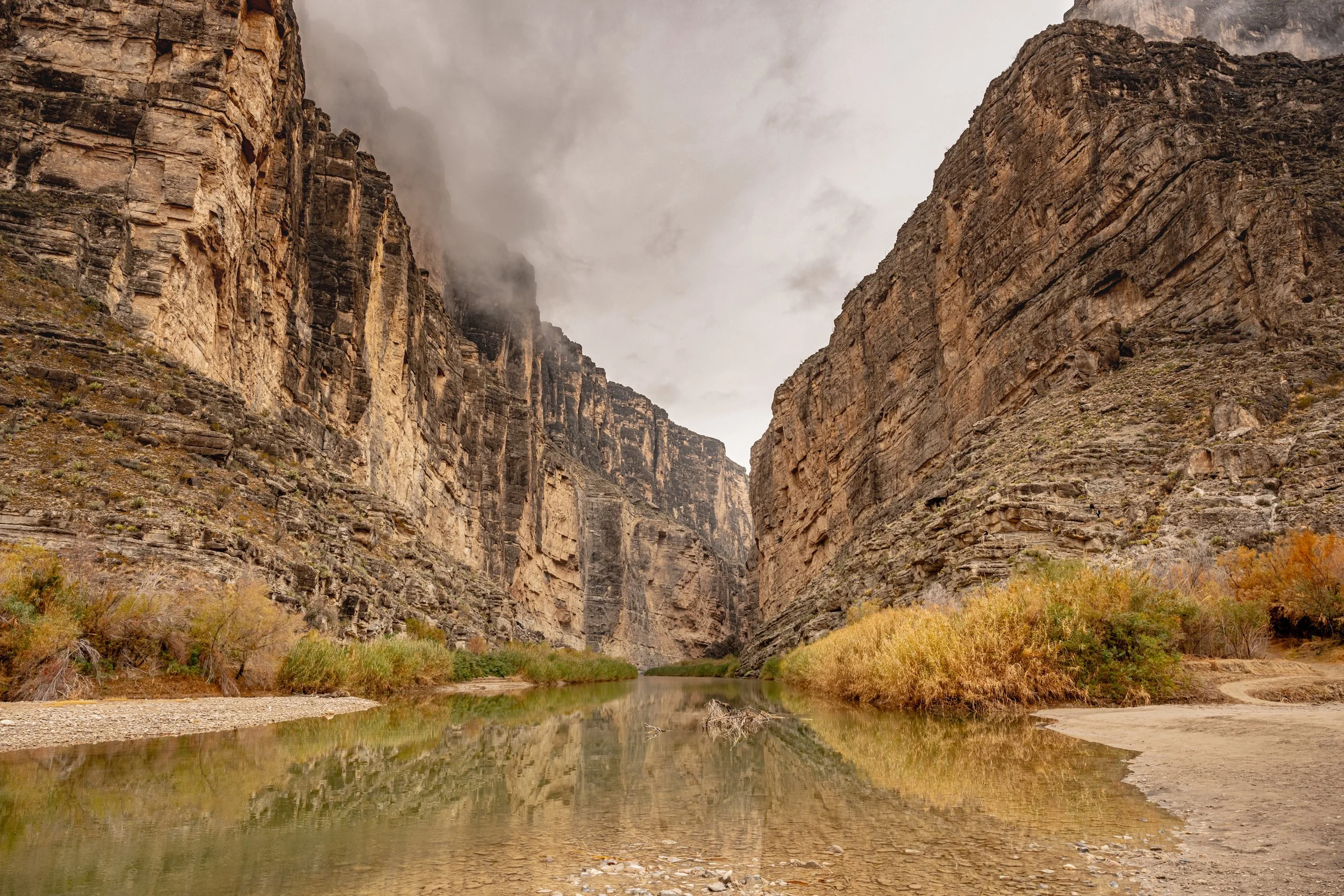 River running between tall canyon walls at Santa Elena Canyon Trail in Big Bend National Park, Texas.