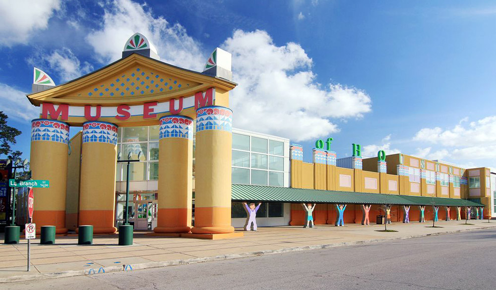 Brightly painted exterior of the Children’s Museum Houston with large columns and playful designs.