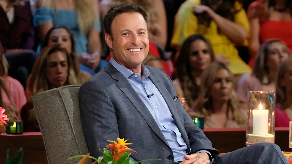 Chris Harrison smiling on set during The Bachelor taping.