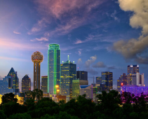 Dallas city skyline at sunset with illuminated skyscrapers representing Texas’s growing film industry.