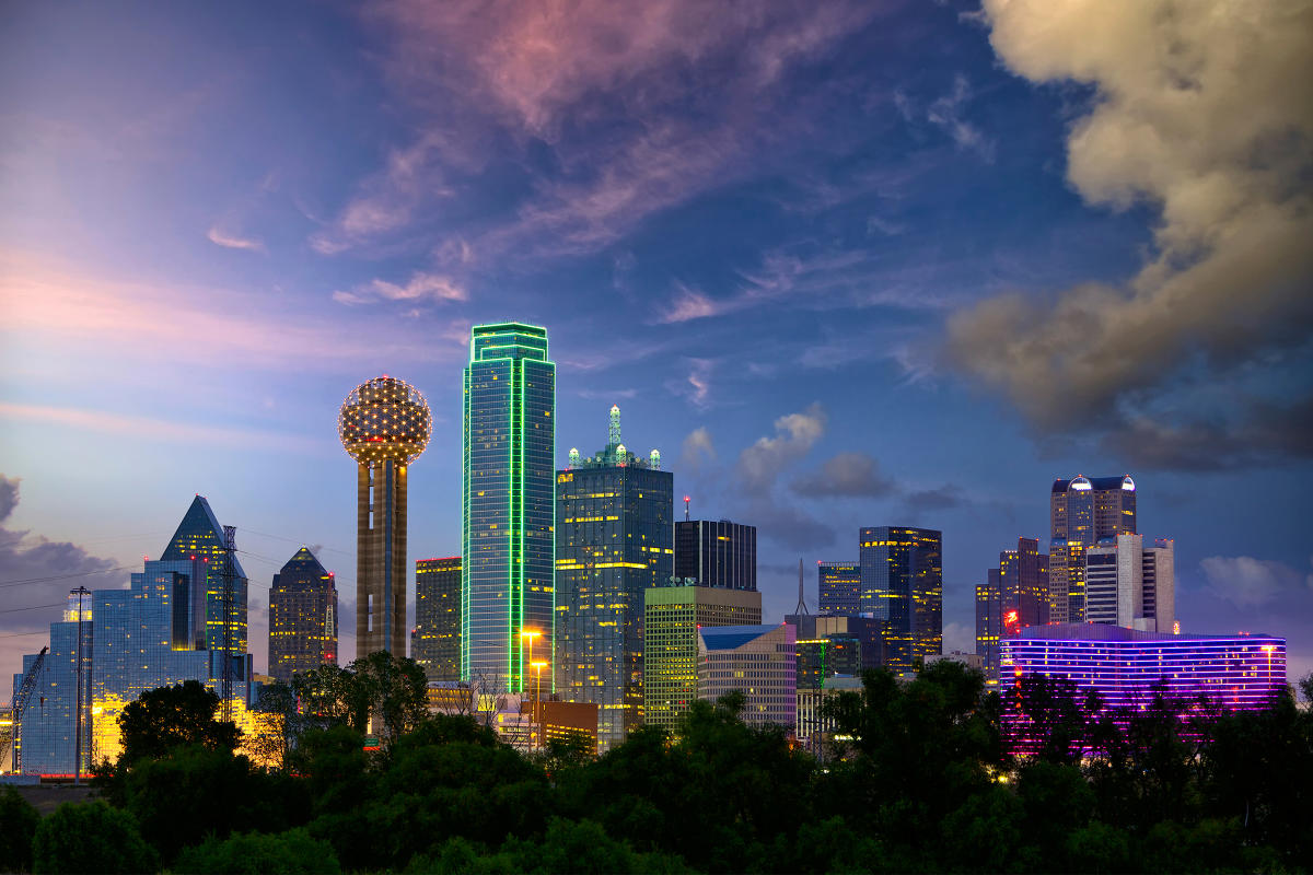 Dallas city skyline at sunset with illuminated skyscrapers representing Texas’s growing film industry.