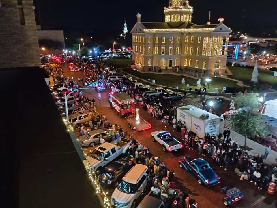 Christmas parade in Marshall Texas showcasing one of the most Christmasy towns in Texas with holiday lights and festive crowds