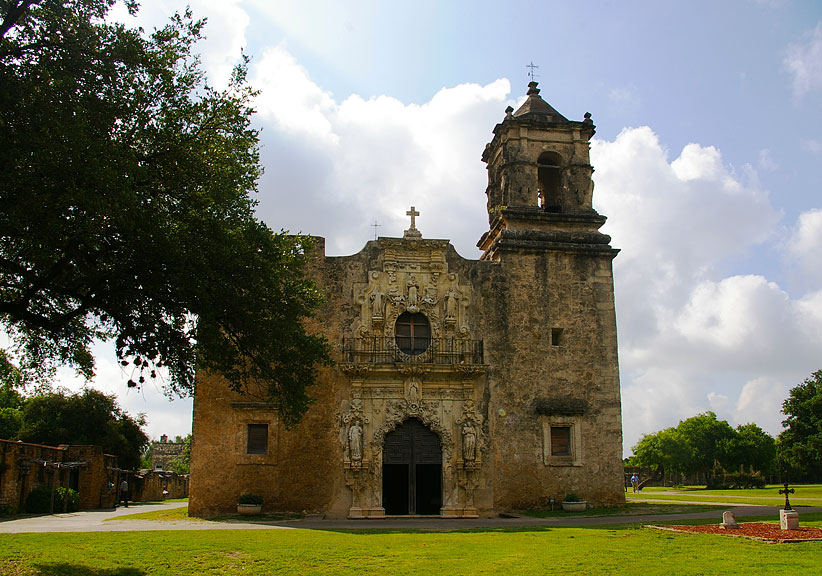 Mission San José in San Antonio, a 1720 Spanish mission and one of the oldest churches in Texas, featuring an ornate stone façade.