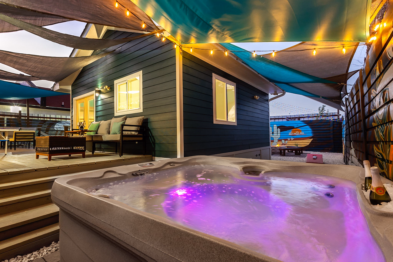 Just a few steps from this hot tub is the private movie theater house.