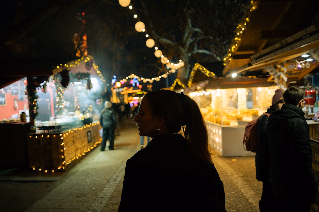 Holiday bazaar in Dallas featuring festive lights, local makers, and seasonal market stalls at night