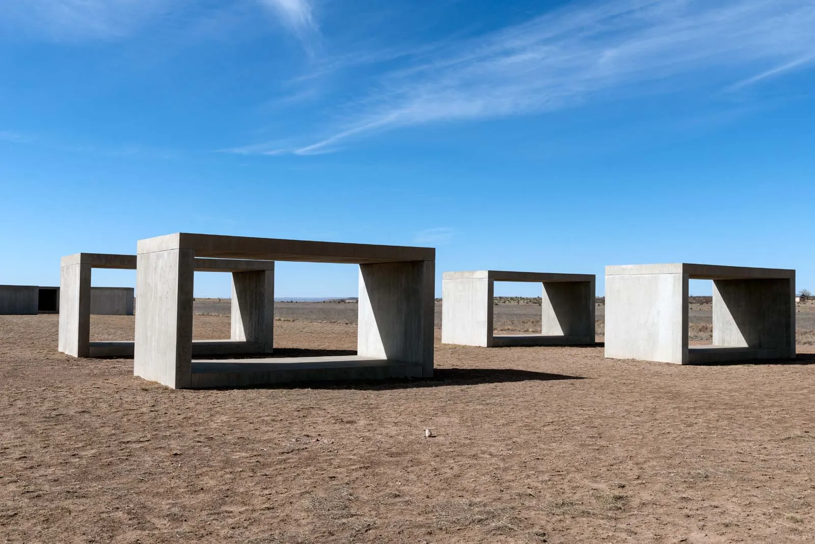 Concrete minimalist art installations at the Chinati Foundation in Marfa, Texas, a key attraction for visitors exploring what Marfa is all about.