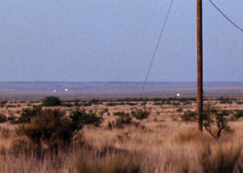 Mysterious Marfa Lights glowing in the Texas desert, a famous unexplained phenomenon that draws visitors to Marfa.