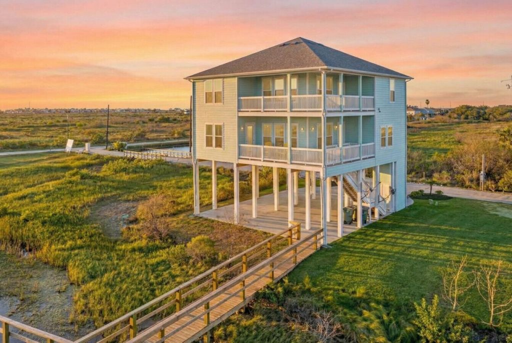 Baydream Believer, a bay house on Galveston's West Bay, at sunset