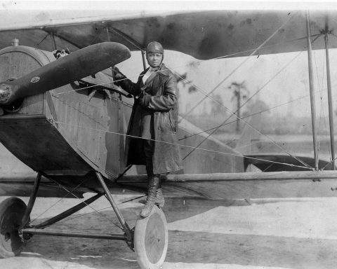 Bessie Coleman with her plane in 1922