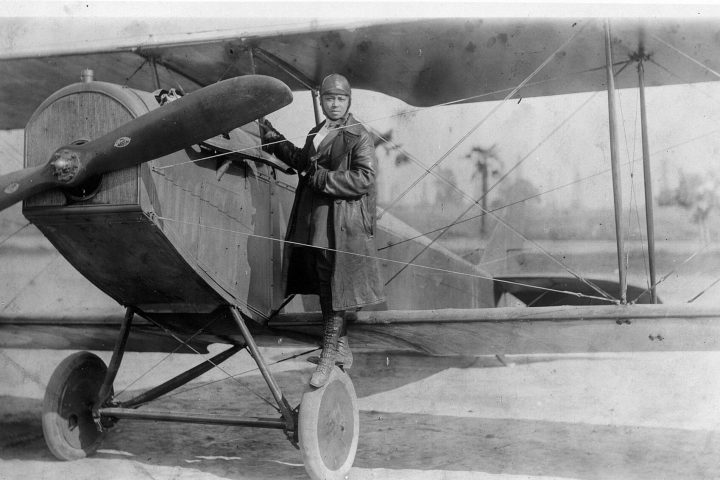 Bessie Coleman with her plane in 1922