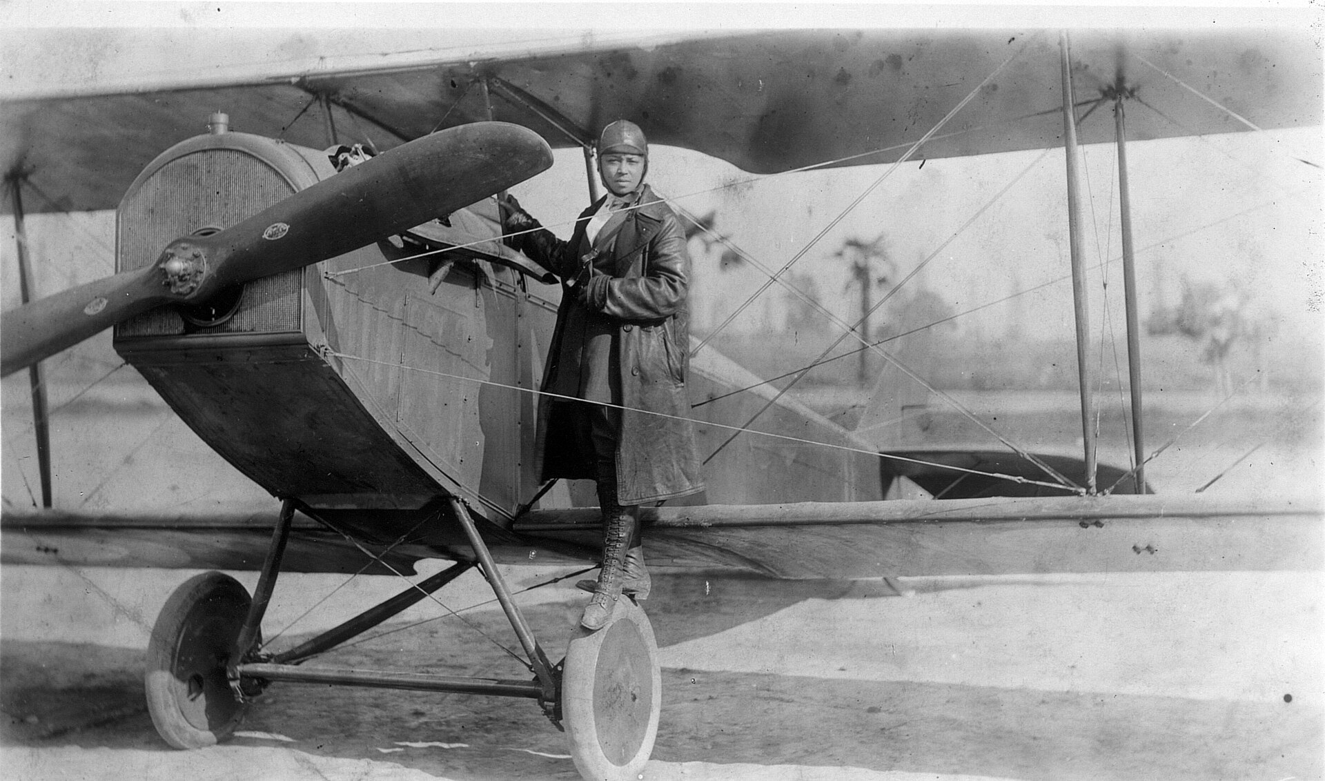 Bessie Coleman with her plane in 1922