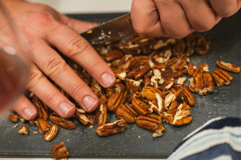 Chopping pecans for holiday baking, a fall ritual in kitchens across Texas