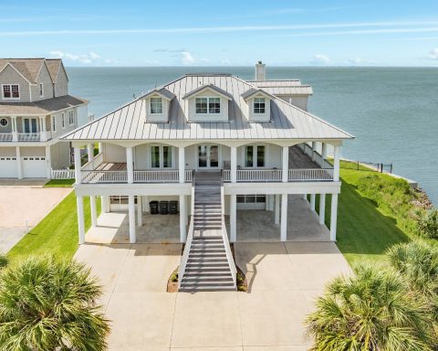 A bayfront estate on Galveston's West End, with a private pool, boat dock, and fishing pier on Galveston Bay