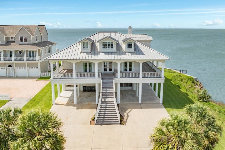 A bayfront estate on Galveston's West End, with a private pool, boat dock, and fishing pier on Galveston Bay