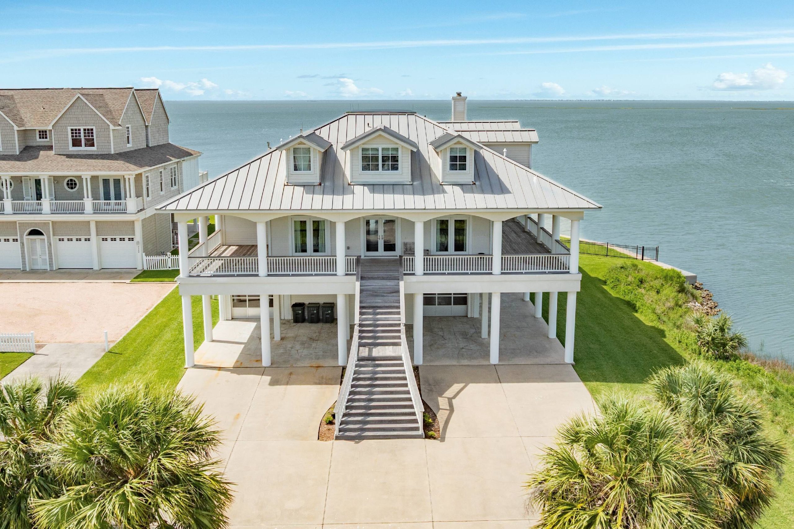 A bayfront estate on Galveston's West End, with a private pool, boat dock, and fishing pier on Galveston Bay