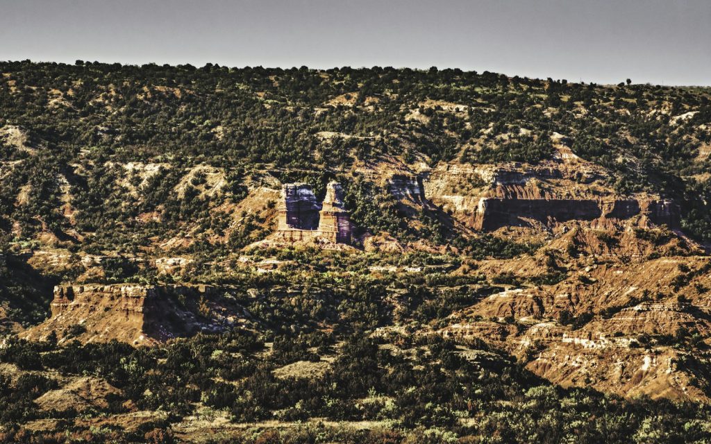 Layered red rock formations stretch across Palo Duro Canyon in the Texas Panhandle